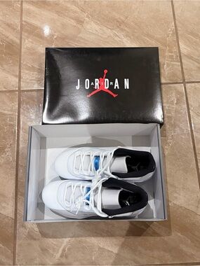 Jordan White and Black Low-Top Sneakers with Blue Tongue Accents
